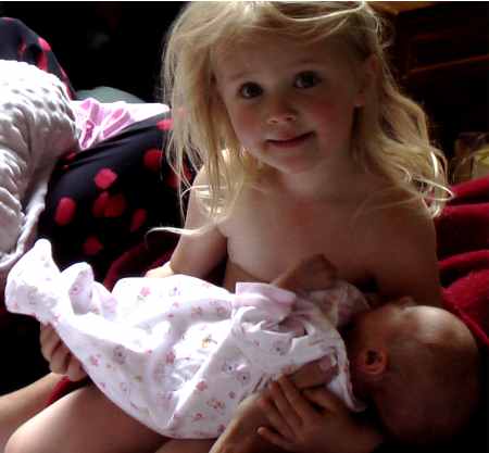 Charlie holding baby Delaney