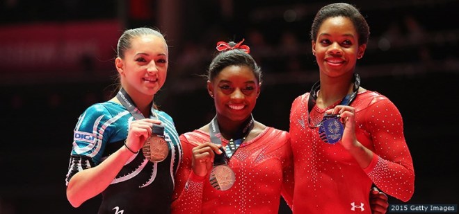 GLASGOW, SCOTLAND - OCTOBER 29:  (l-r) Larisa Andreea Iordache of Romania wins bronze, Simone Biles of USA wins gold and Gabrielle Douglas of USA wins silver medal in the All-Around Final on day seven of the 2015 World Artistic Gymnastics Championships at The SSE Hydro on October 29, 2015 in Glasgow, Scotland.  (Photo by Alex Livesey/Getty Images)