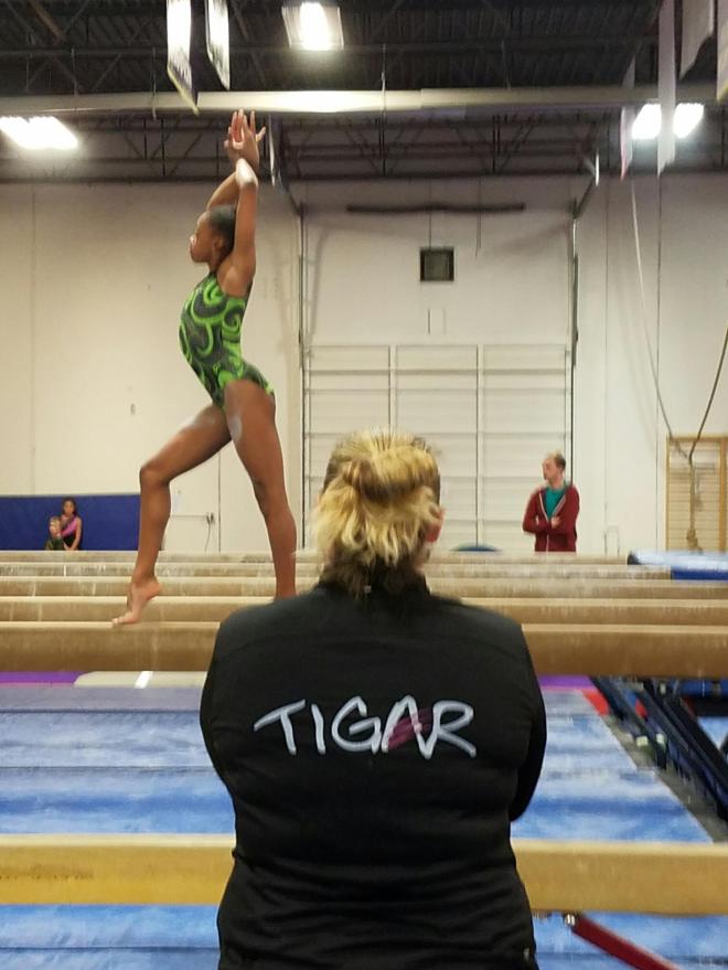 Jenn coaching Jay Jay on Beam